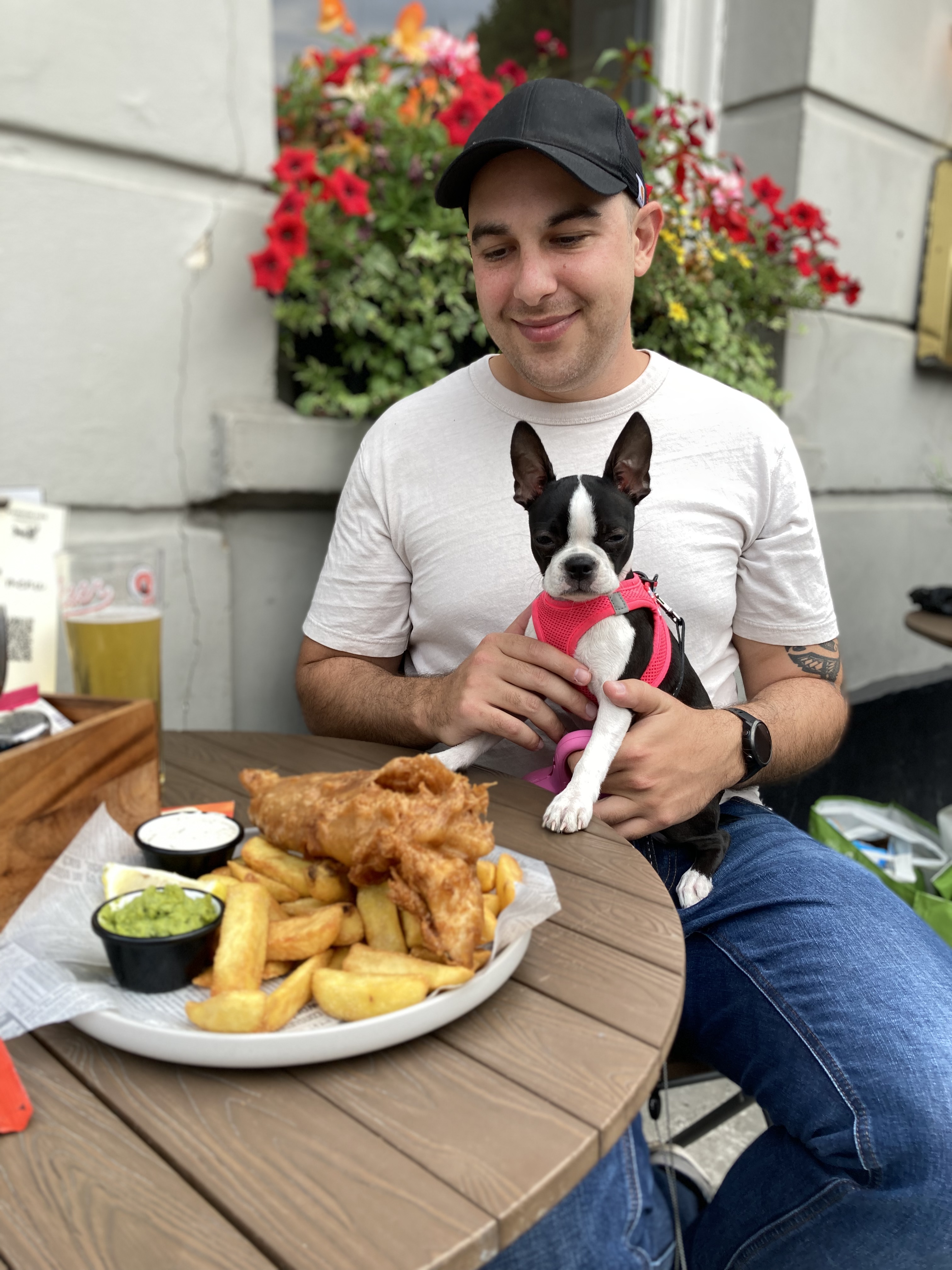 Me and my puppy eating fish and chips at a pub